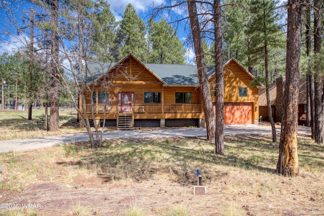 5238 Buck Springs Rd, Pinetop, AZ 85935 - cabin featuring driveway, roof with shingles, and an attached garage
