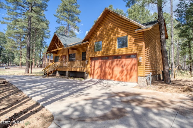 5238 Buck Springs Rd, Pinetop, AZ 85935 - view of property exterior featuring a porch, concrete driveway, and an attached garage