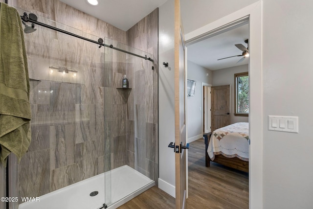 2051 N Bison Pass Ct, Show Low, AZ 85901 - ensuite bathroom with ceiling fan, a shower stall, wood finished floors, and baseboards