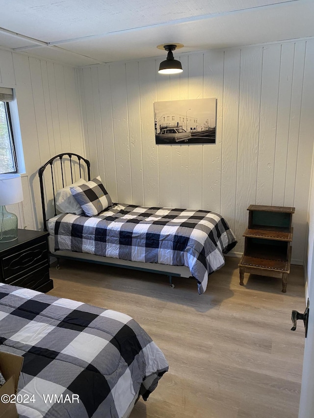 bedroom featuring wood finished floors