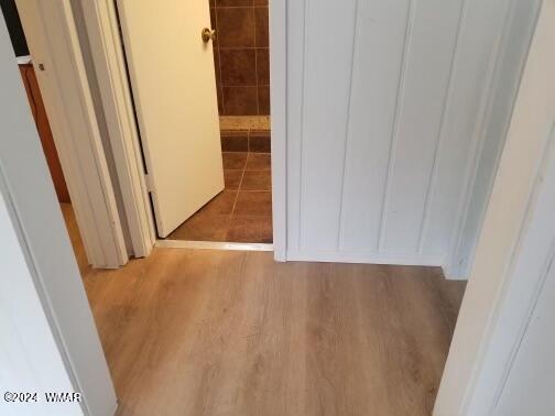 hallway with light wood-style flooring