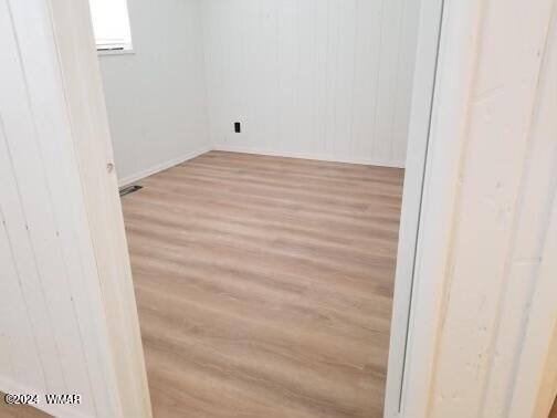 empty room with light wood-style flooring