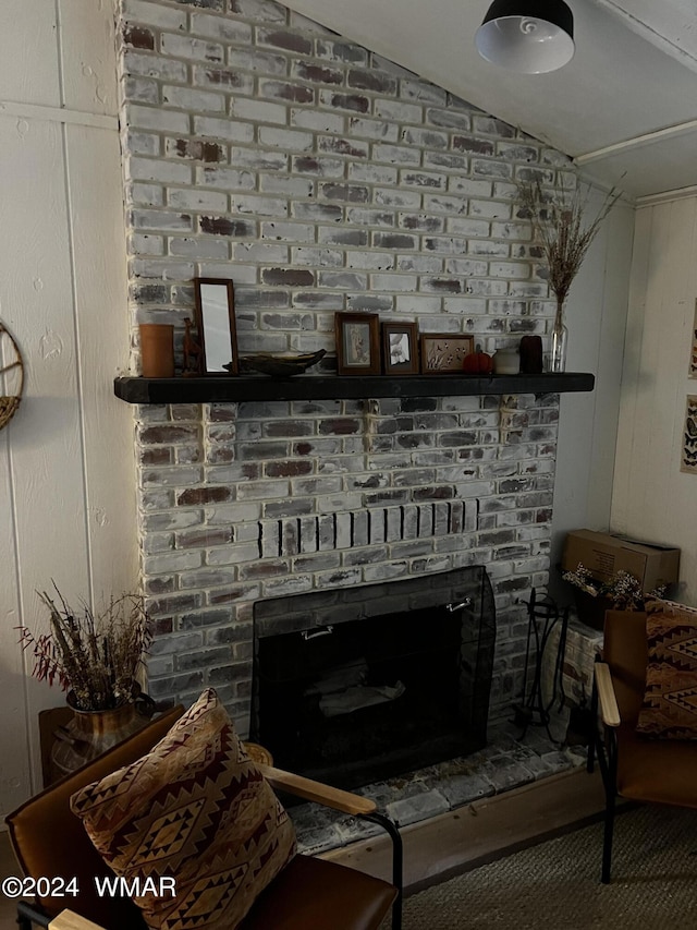 room details featuring a brick fireplace