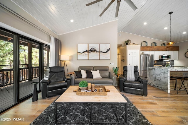 living room with light wood-type flooring, ceiling fan, vaulted ceiling, recessed lighting, and wooden ceiling