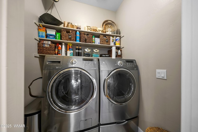 washroom featuring washing machine and clothes dryer