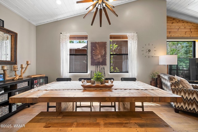 dining room with vaulted ceiling, wood finished floors, ceiling fan, and wood ceiling