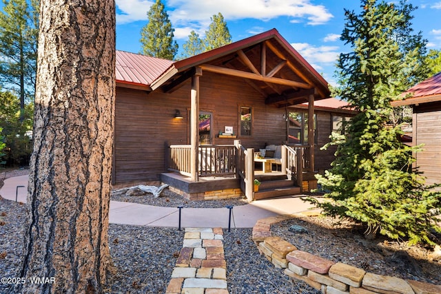 2870 W Lodgepole Ln, Show Low, AZ 85901 - rear view of property with metal roof and a porch
