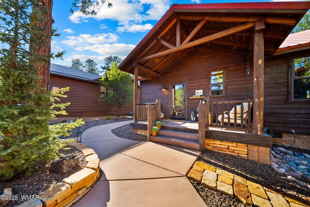 2870 W Lodgepole Ln, Show Low, AZ 85901 - entrance to property featuring metal roof and a porch