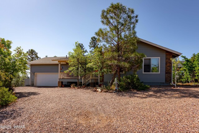 7431 N Gemini Ln, Lakeside, AZ 85929 - view of property hidden behind natural elements featuring driveway, crawl space, and an attached garage