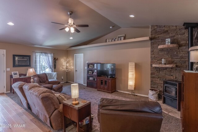 7431 N Gemini Ln, Lakeside, AZ 85929 - living area featuring a wood stove, lofted ceiling, a ceiling fan, baseboards, and recessed lighting