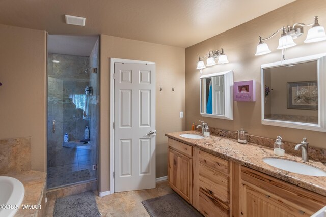 7431 N Gemini Ln, Lakeside, AZ 85929 - full bathroom featuring a stall shower, double vanity, a bath, and tile patterned floors