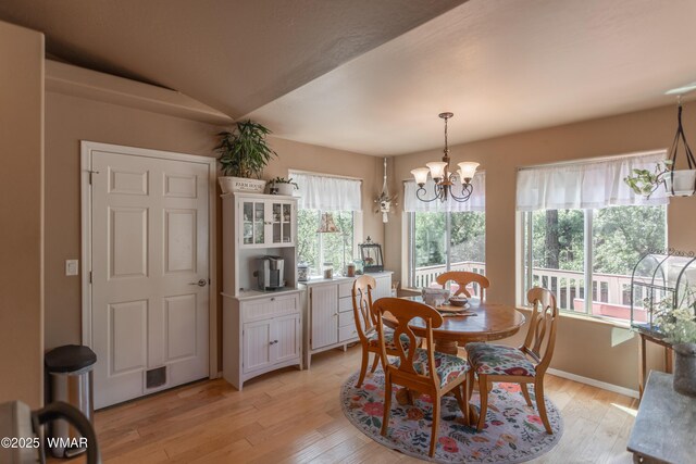 7431 N Gemini Ln, Lakeside, AZ 85929 - dining area featuring light wood-style floors and a chandelier