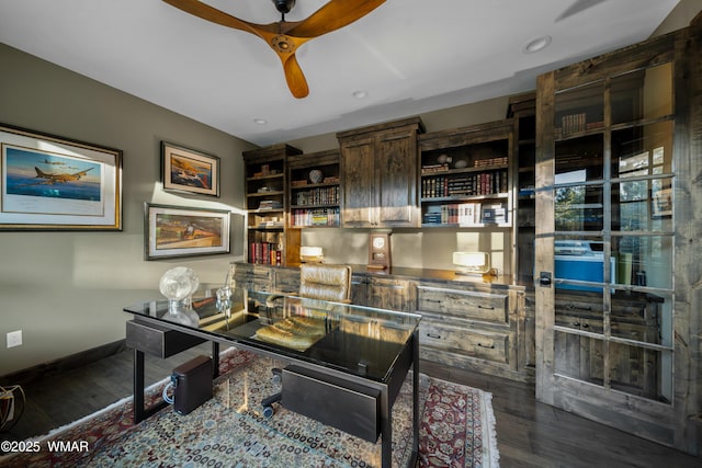 office featuring ceiling fan, baseboards, and wood finished floors