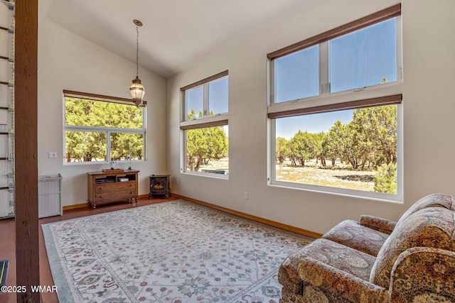 2335 Voyager Cir, Overgaard, AZ 85933 - sitting room with lofted ceiling, wood finished floors, and baseboards