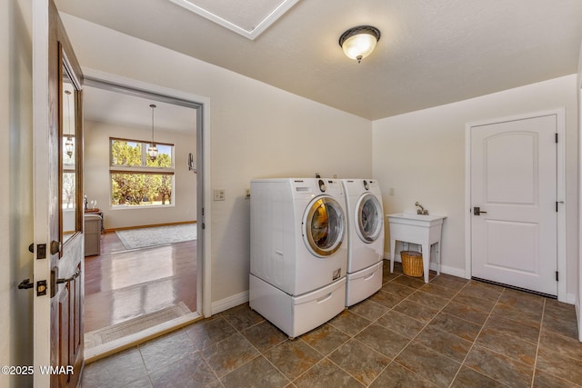 2335 Voyager Cir, Overgaard, AZ 85933 - laundry area featuring washing machine and dryer and baseboards