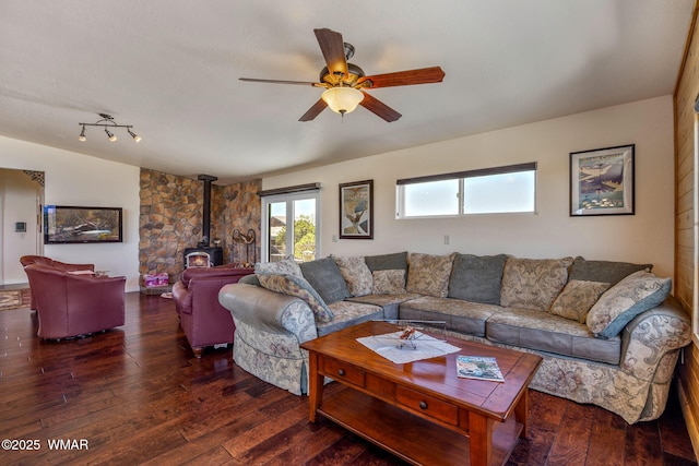 2335 Voyager Cir, Overgaard, AZ 85933 - living area with a wood stove, a ceiling fan, and hardwood / wood-style flooring