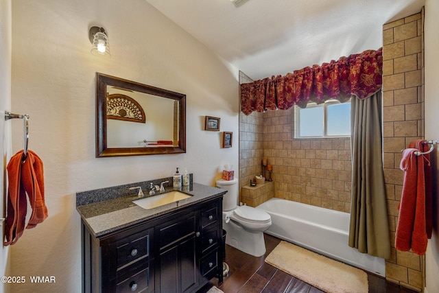 2335 Voyager Cir, Overgaard, AZ 85933 - bathroom featuring vaulted ceiling, toilet, vanity, wood finished floors, and shower / tub combo