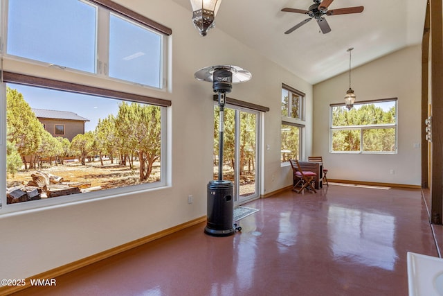 2335 Voyager Cir, Overgaard, AZ 85933 - spare room with finished concrete floors, baseboards, ceiling fan, and high vaulted ceiling