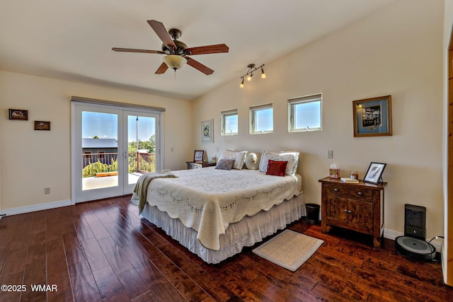 2335 Voyager Cir, Overgaard, AZ 85933 - bedroom with access to outside, multiple windows, dark wood-style flooring, and lofted ceiling