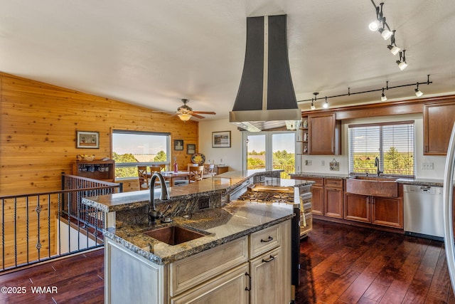2335 Voyager Cir, Overgaard, AZ 85933 - kitchen featuring stainless steel dishwasher, ventilation hood, a sink, gas range oven, and healthy amount of natural light
