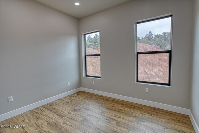 4668 W Tatanka Loop, Show Low, AZ 85901 - unfurnished room with baseboards, wood finished floors, and recessed lighting