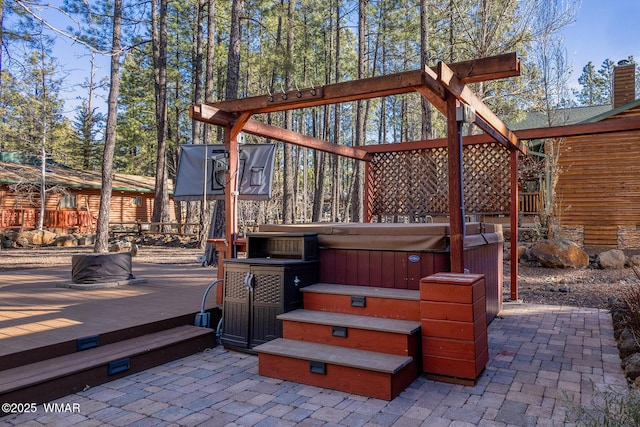 view of patio / terrace featuring a deck and a hot tub