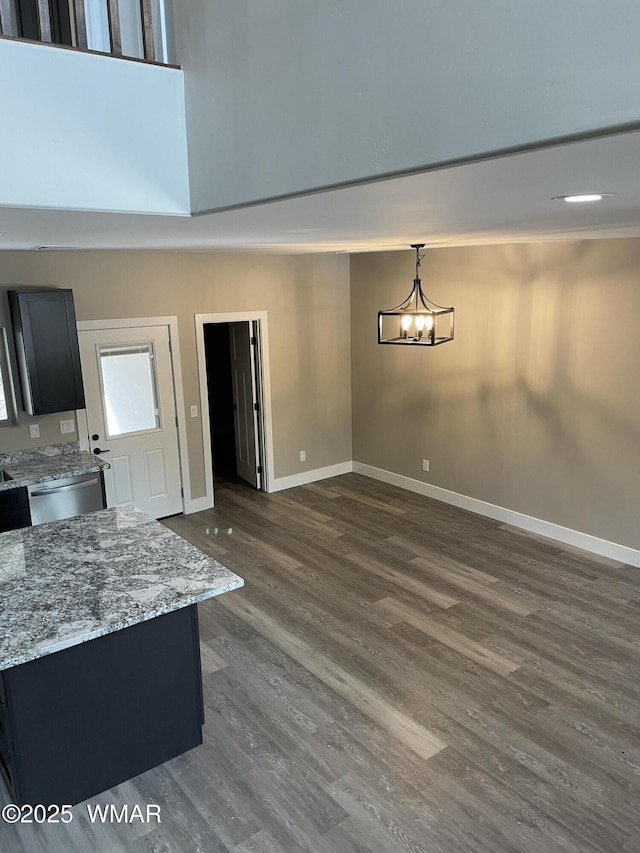 2426 Aspen Run, Pinetop, AZ 85935 - interior space with dark wood-type flooring, baseboards, and a notable chandelier