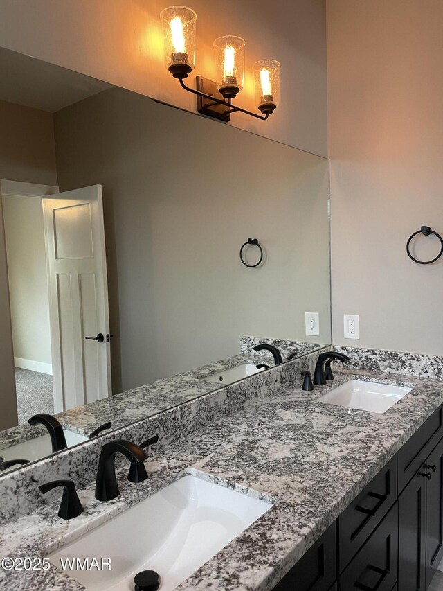 2426 Aspen Run, Pinetop, AZ 85935 - bathroom featuring double vanity, a sink, and an inviting chandelier