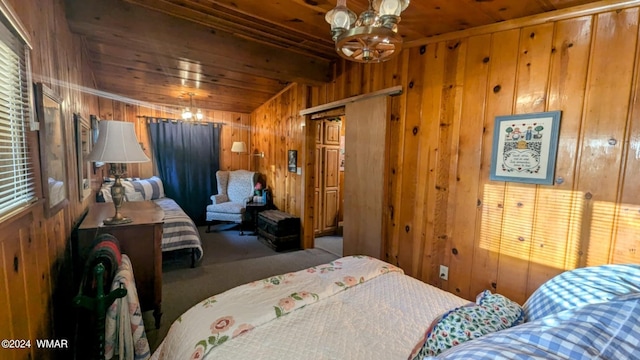 219 Yeager Ln, Lakeside, AZ 85929 - carpeted bedroom featuring wooden walls, wood ceiling, and a chandelier