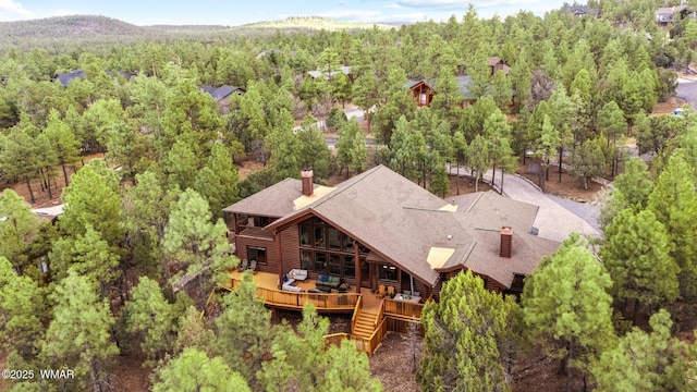 aerial view featuring a forest view