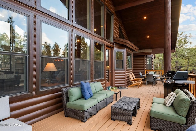 wooden terrace featuring grilling area and outdoor lounge area