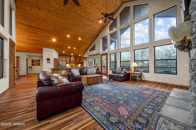 living room with wood ceiling, light wood-type flooring, and a wealth of natural light