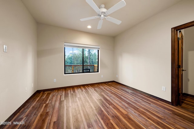 spare room with recessed lighting, wood finished floors, a ceiling fan, and baseboards