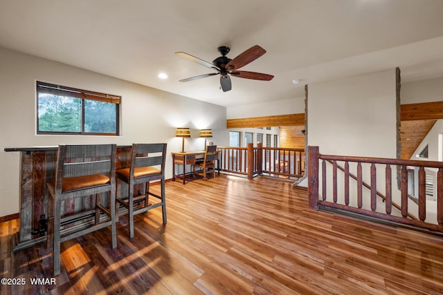 interior space featuring wood finished floors, a ceiling fan, and recessed lighting