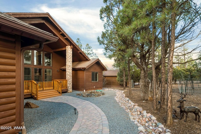 exterior space with faux log siding