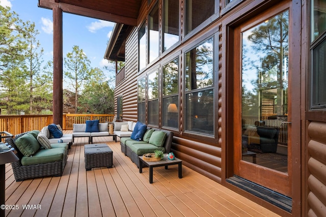 wooden terrace featuring outdoor lounge area