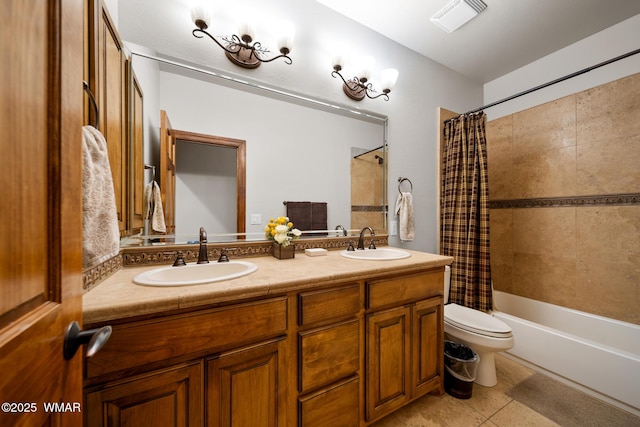 bathroom featuring toilet, shower / bath combination with curtain, visible vents, and a sink