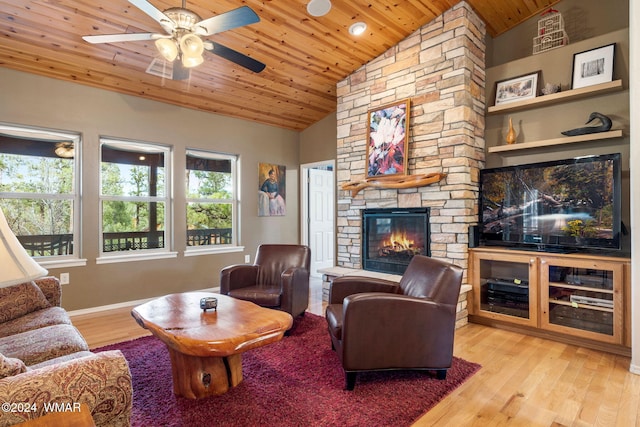 living room featuring a stone fireplace, wooden ceiling, baseboards, vaulted ceiling, and light wood-style floors