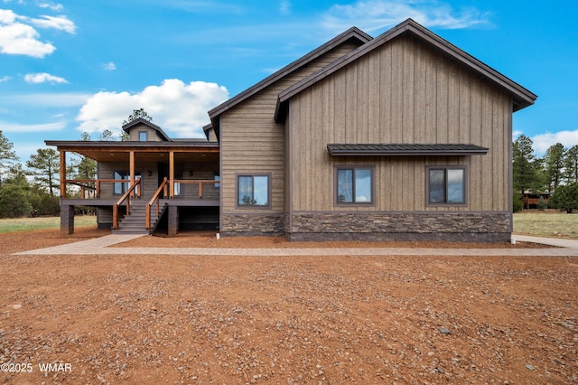 1380 Lakeside Trl, Show Low, AZ 85901 - view of front of property featuring stone siding, a standing seam roof, a porch, and metal roof