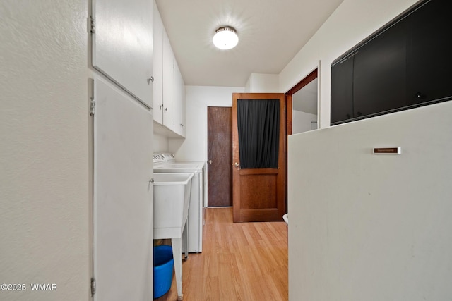 2681 W Reidhead, Show Low, AZ 85901 - washroom with cabinet space, washer and clothes dryer, and light wood-style flooring