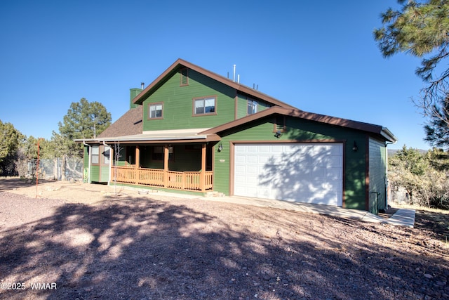 view of front facade with dirt driveway, covered porch, a garage, and a chimney