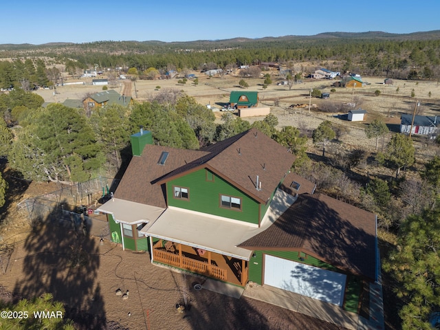 birds eye view of property featuring a mountain view