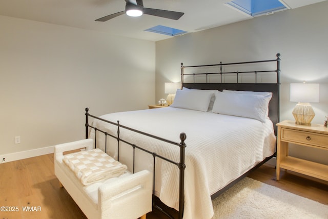 3651 Crown Dancer Dr Unit 8, Pinetop, AZ 85935 - bedroom with a ceiling fan, baseboards, and wood finished floors