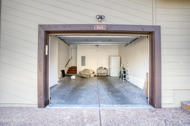 3651 Crown Dancer Dr Unit 8, Pinetop, AZ 85935 - garage featuring electric panel and freestanding refrigerator