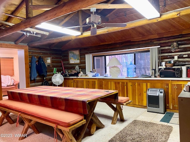 interior space featuring rustic walls, lofted ceiling with beams, wood ceiling, ceiling fan, and heating unit