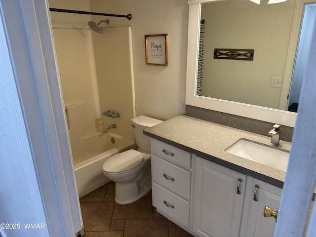 bathroom featuring toilet, shower / bath combination, tile patterned floors, and vanity