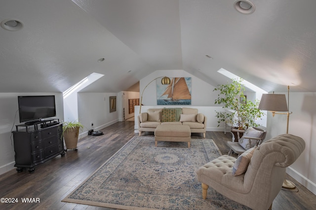 living room with vaulted ceiling with skylight, baseboards, and dark wood finished floors