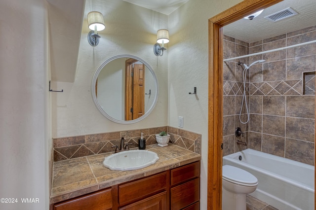 full bath featuring visible vents, a textured wall, toilet, bathing tub / shower combination, and vanity