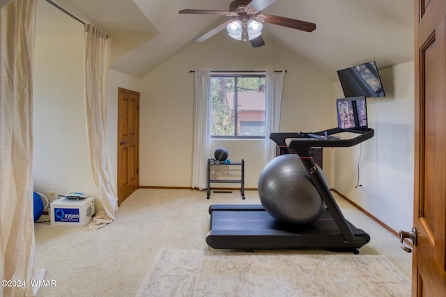 exercise area with lofted ceiling, carpet, baseboards, and ceiling fan