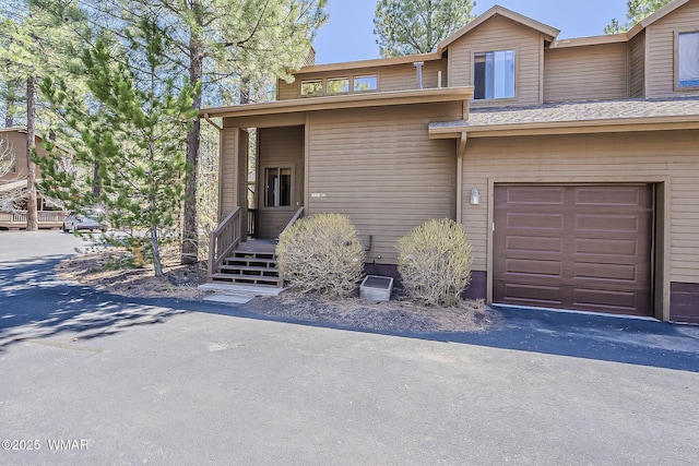 4509 Stone Pine Dr, Pinetop, AZ 85935 - view of front facade featuring a garage and asphalt driveway